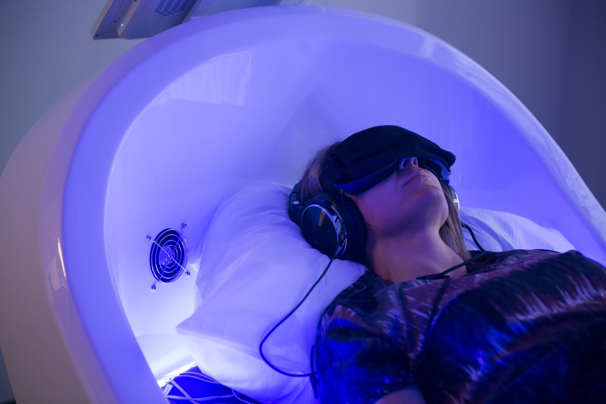 A client resting during a Theta Chamber session.